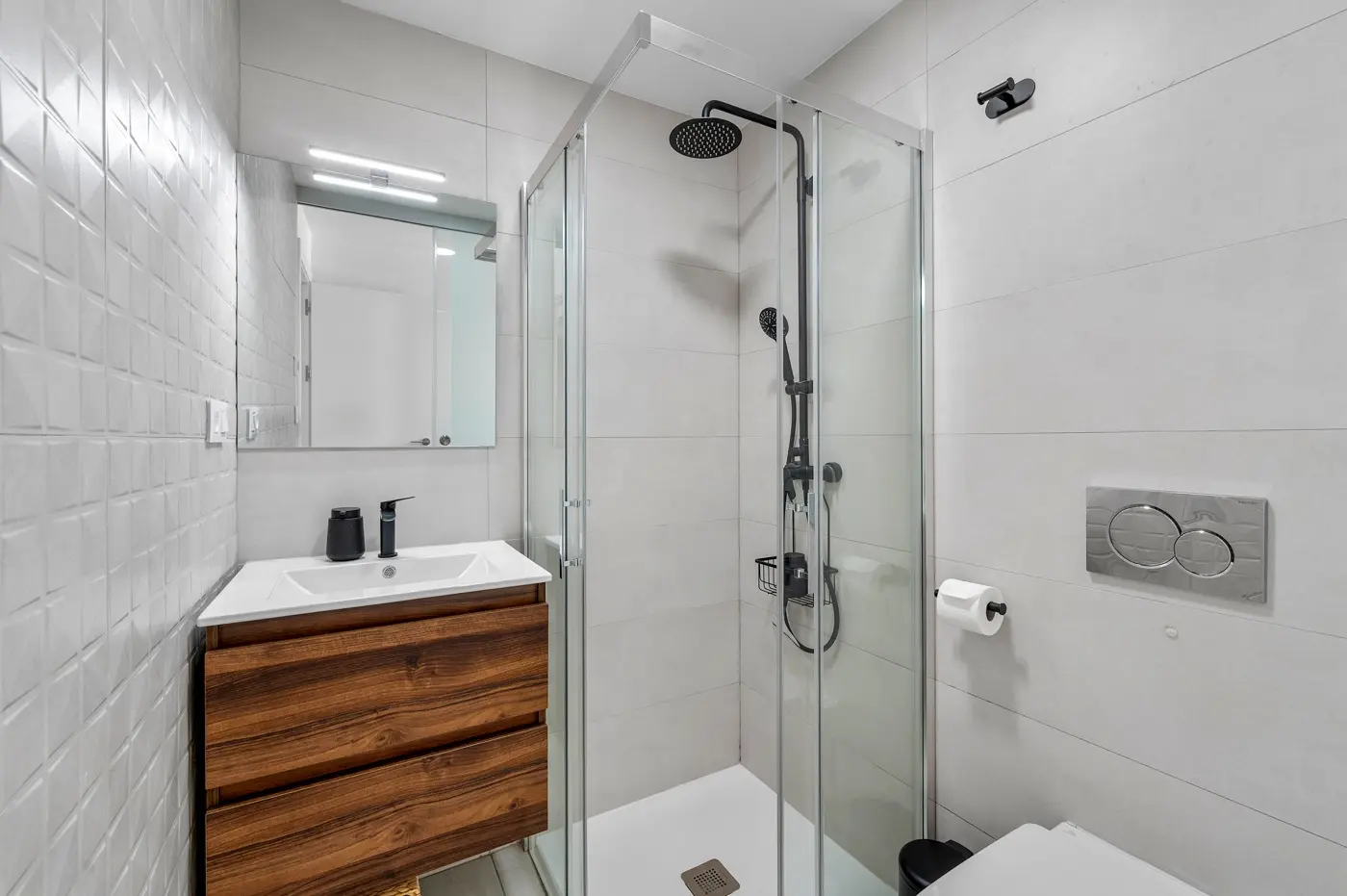 Shower room with wooden vanity, glass shower and wall-hung toilet